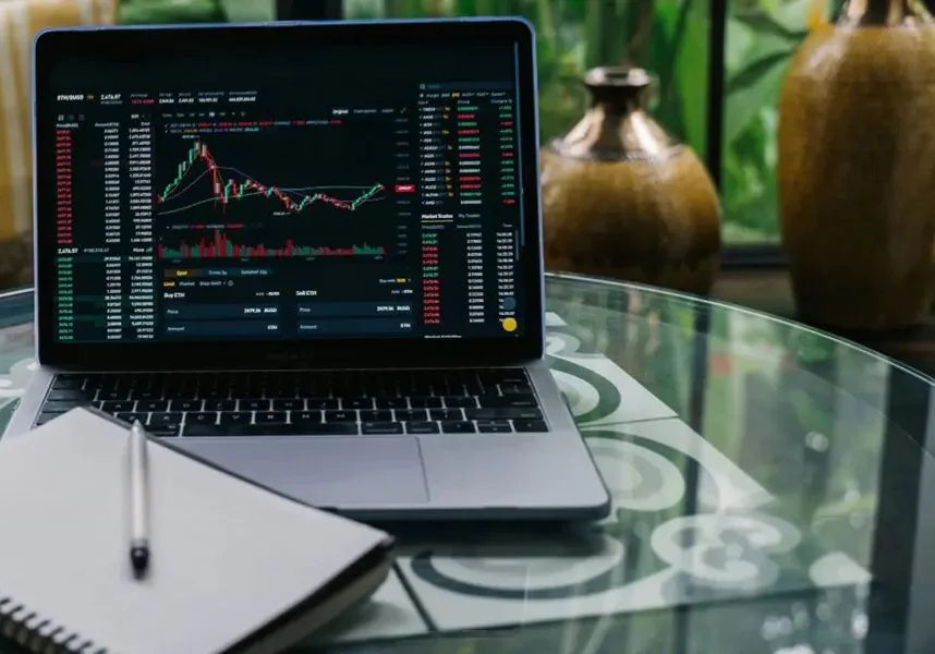 Stock charts on a laptop screen